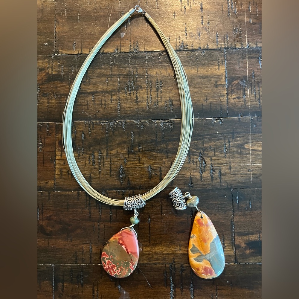 Artistic Gold Necklace with Earthy Stone Pendants